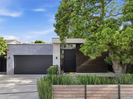 a front view of a house with garage