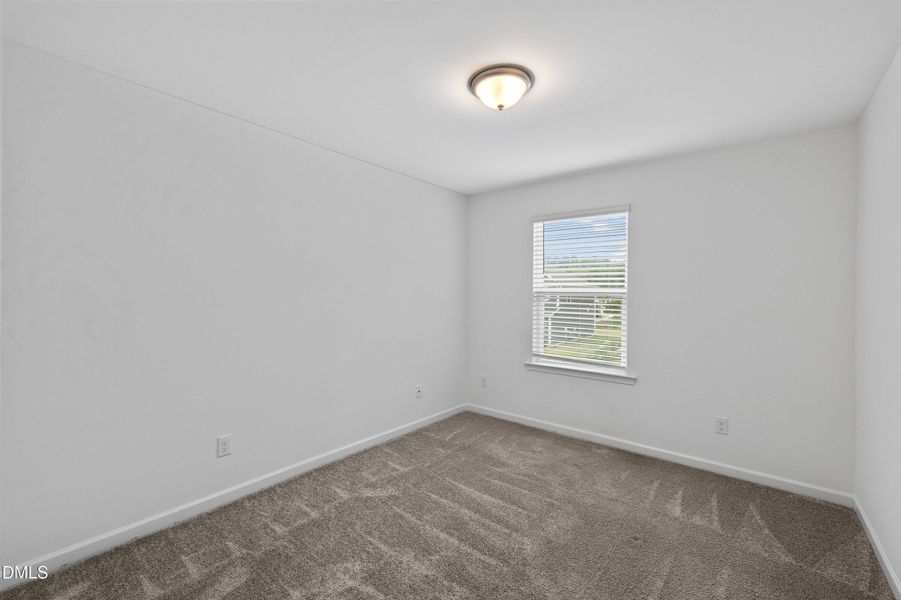 2129 Crestwood Rdg Drive Durham, NC 27704 - Photo 12 of 15 an empty room with a window