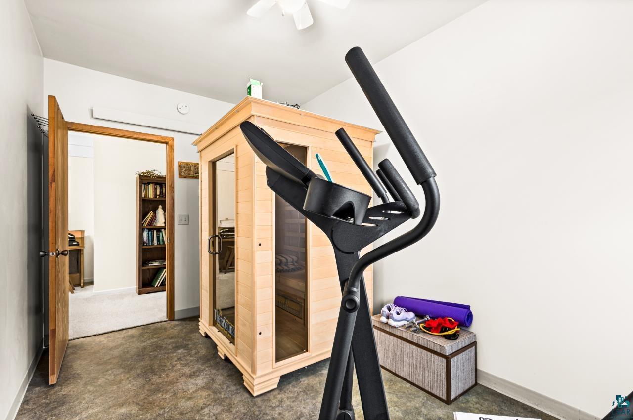 3723 Birchwood Road Kettle River, MN 55757 - Photo 18 of 48 Workout room with baseboards and a relaxing sauna