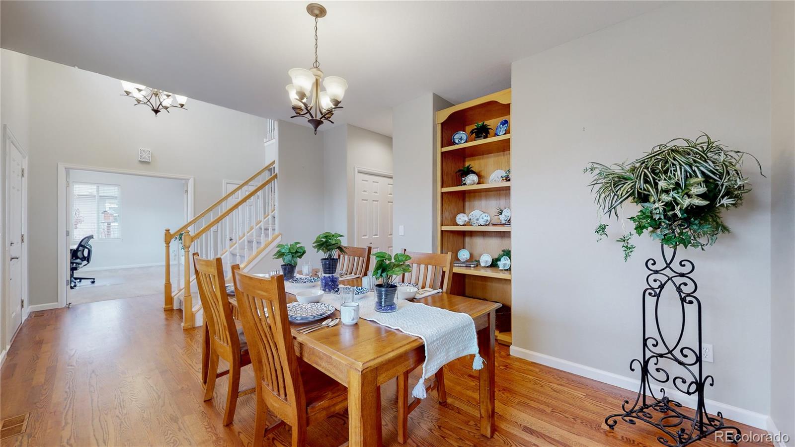 Undisclosed Address Longmont, CO 80504 - Photo 12 of 40 a view of a dining room with furniture and wooden floor