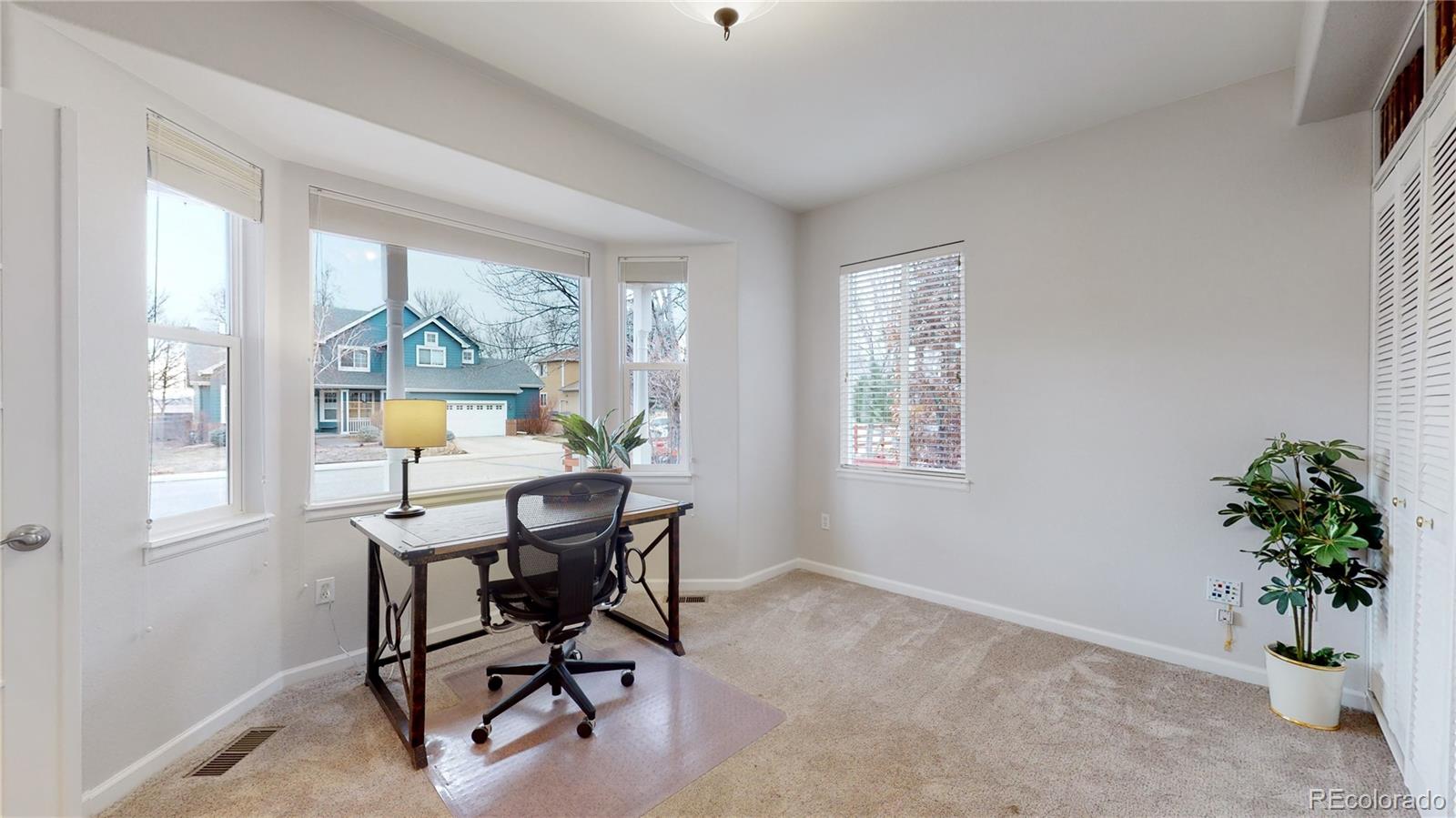 Undisclosed Address Longmont, CO 80504 - Photo 15 of 40 a view of a workspace with furniture and a window