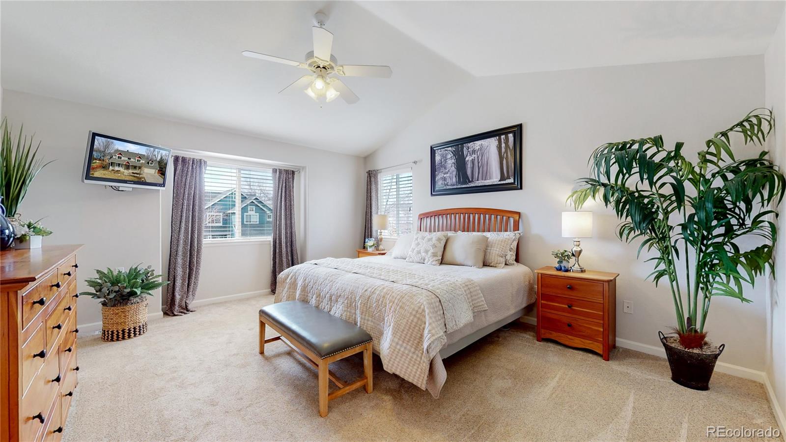 Undisclosed Address Longmont, CO 80504 - Photo 20 of 40 a bedroom with a large bed and a potted plant