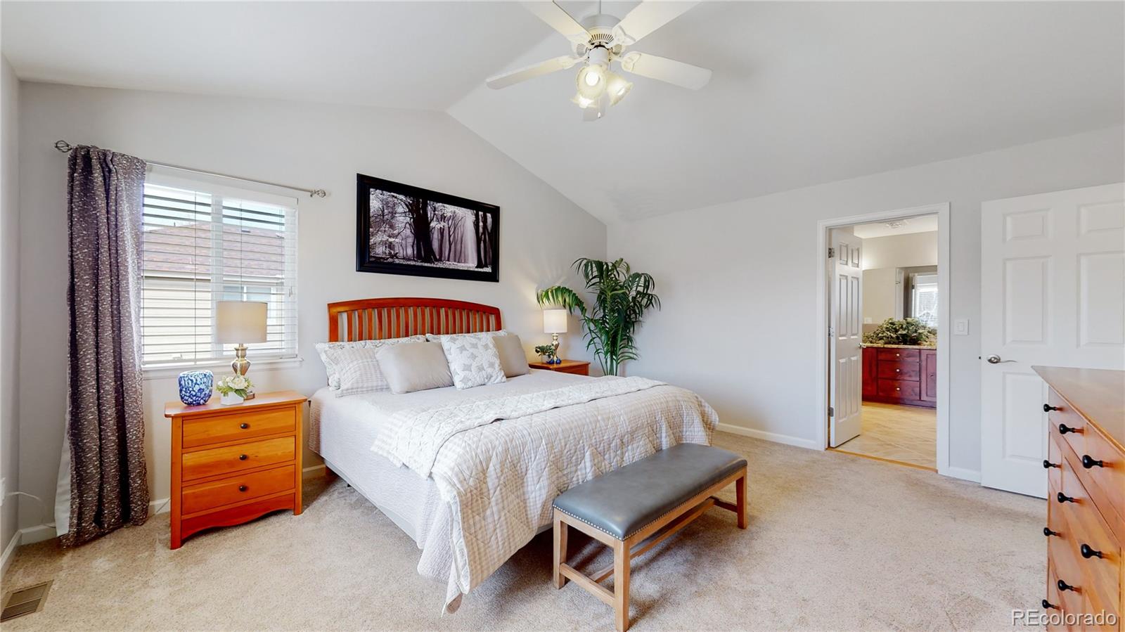 Undisclosed Address Longmont, CO 80504 - Photo 23 of 40 a bedroom with a bed and a chandelier