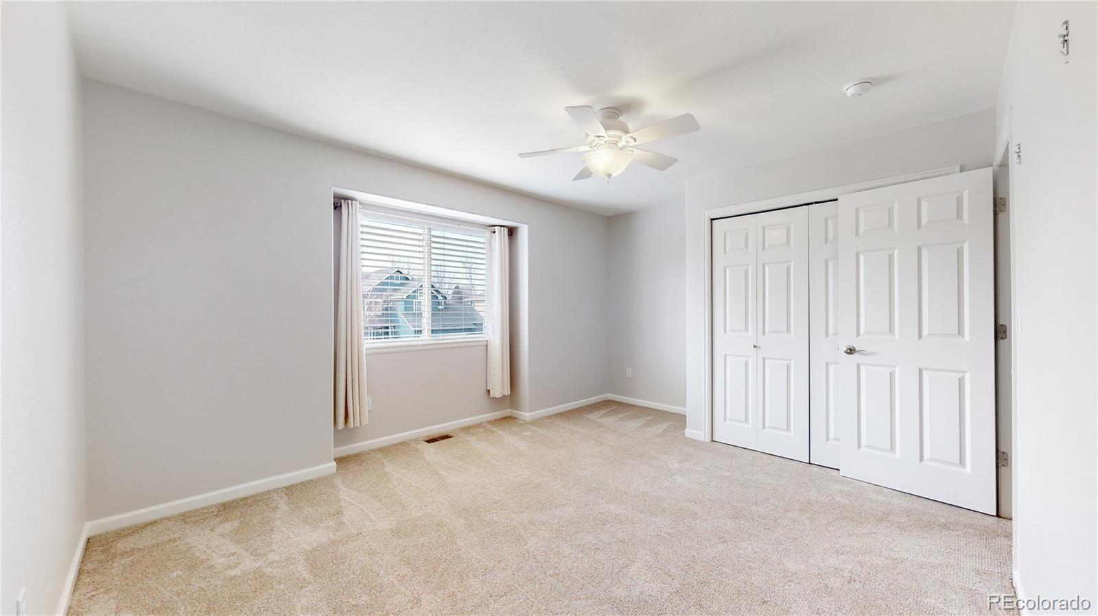 Undisclosed Address Longmont, CO 80504 - Photo 30 of 40 a view of an empty room with a window