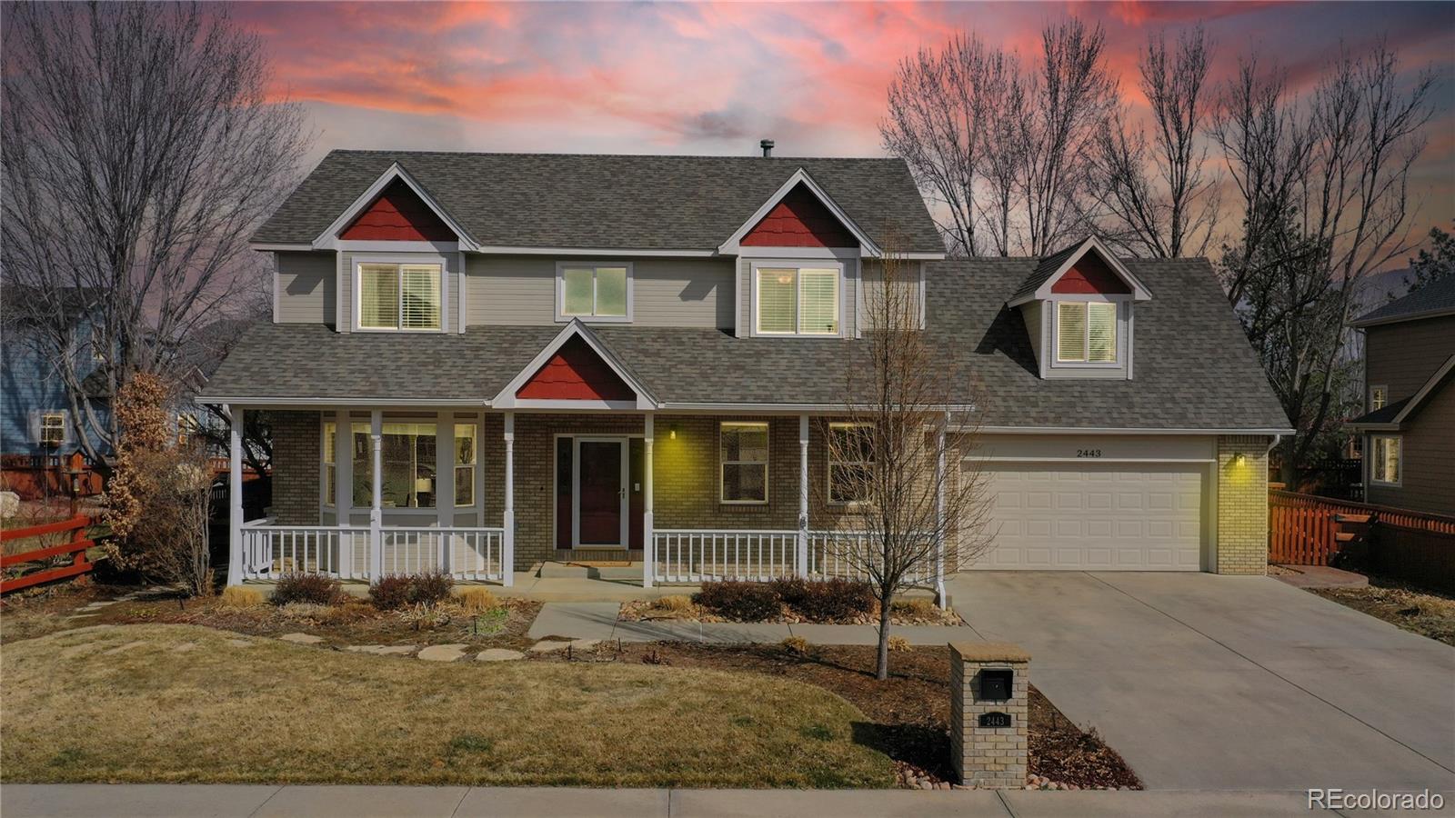 Undisclosed Address Longmont, CO 80504 - Photo 3 of 40 a front view of a house with garden