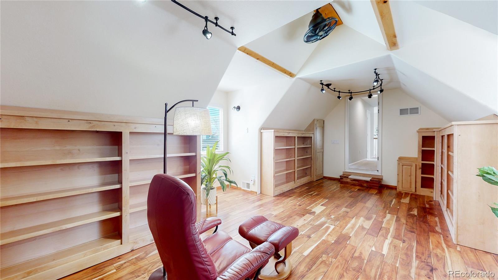 Undisclosed Address Longmont, CO 80504 - Photo 32 of 40 a view of a livingroom with furniture and a ceiling fan