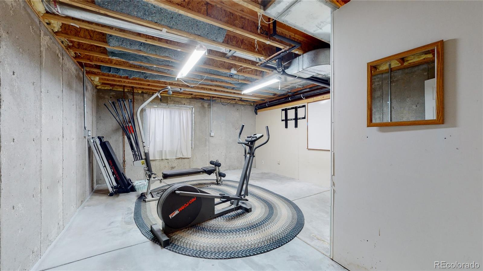 Undisclosed Address Longmont, CO 80504 - Photo 34 of 40 a view of a room with gym equipment