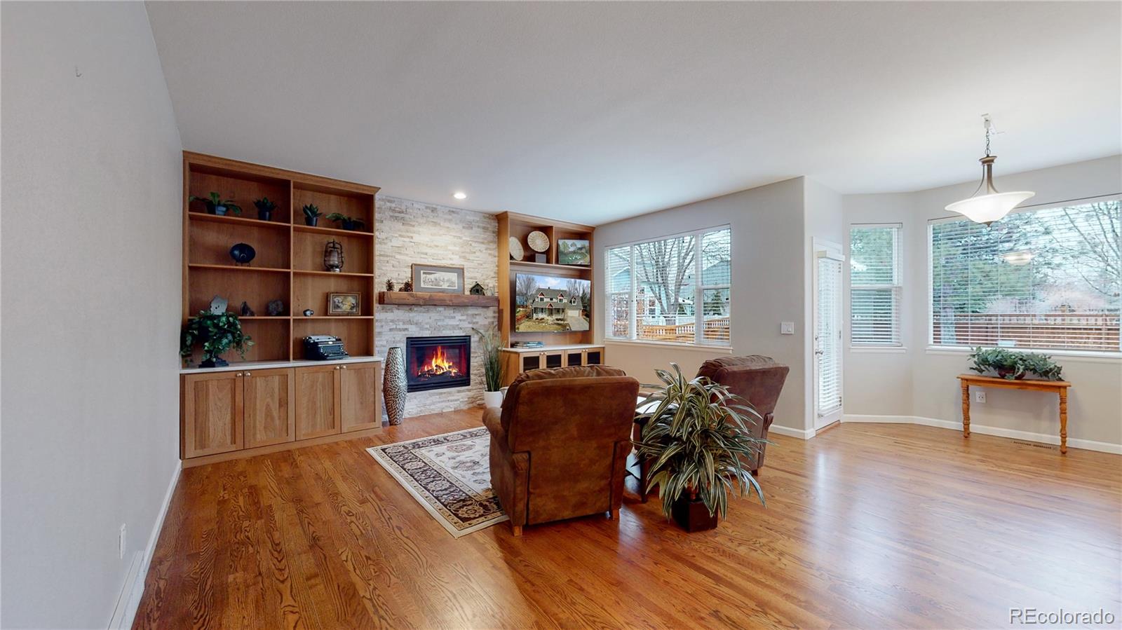 Undisclosed Address Longmont, CO 80504 - Photo 4 of 40 a living room with furniture and a wooden floor