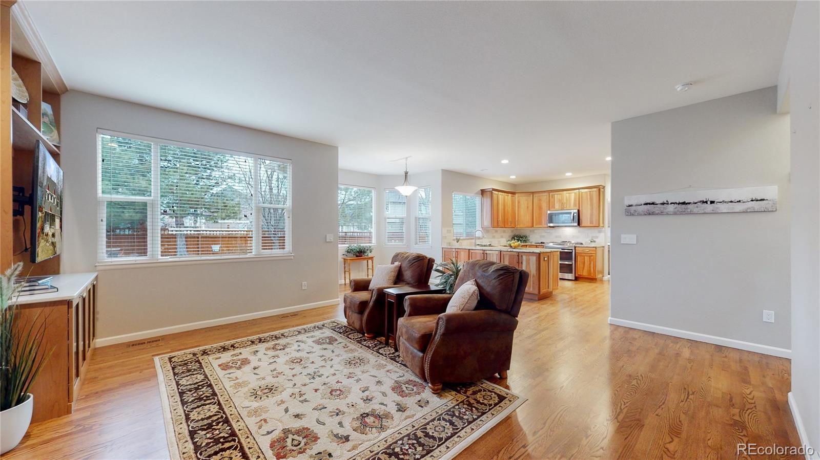 Undisclosed Address Longmont, CO 80504 - Photo 5 of 40 a living room with furniture and a flat screen tv