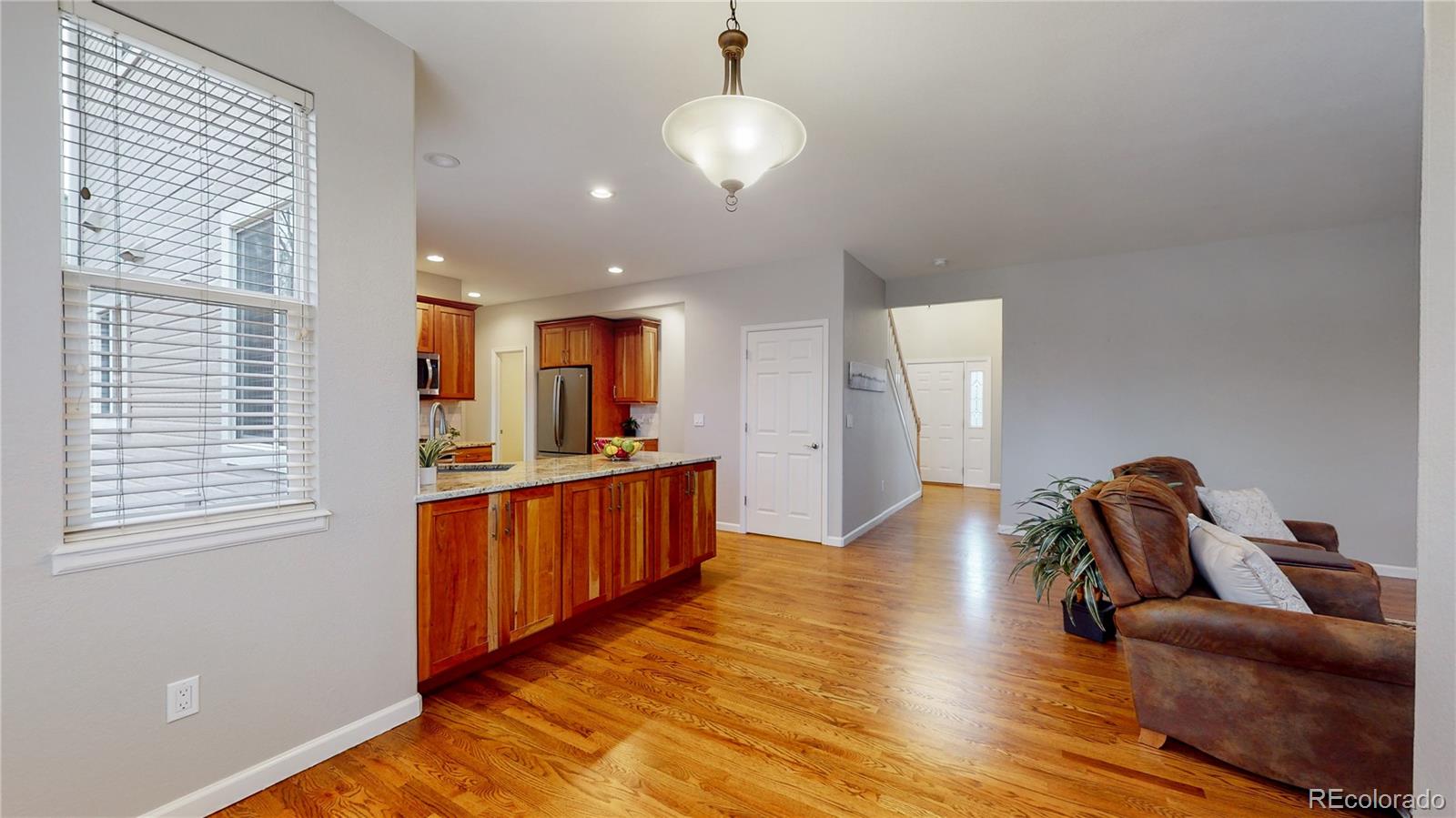 Undisclosed Address Longmont, CO 80504 - Photo 9 of 40 a view of hallway with furniture and wooden floor