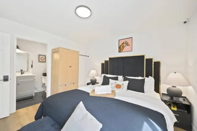 a bedroom with a bed and furniture