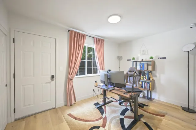 a work room with furniture and a window