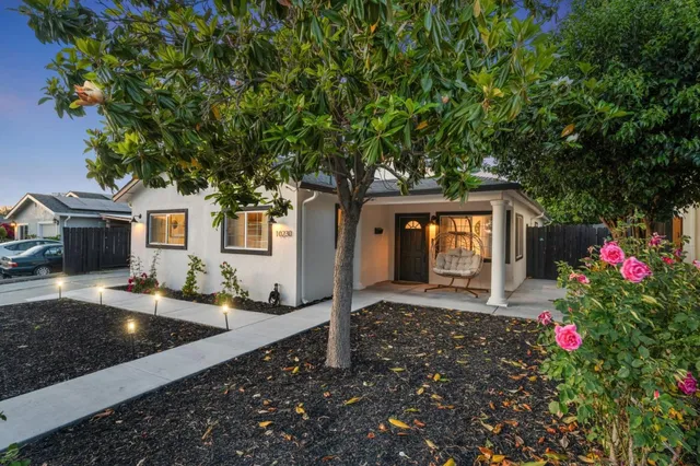 a front view of a house with yard