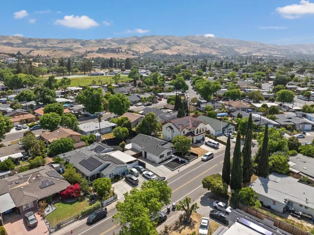 an aerial view of residential houses with outdoor space