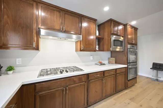 a kitchen with a sink and cabinets