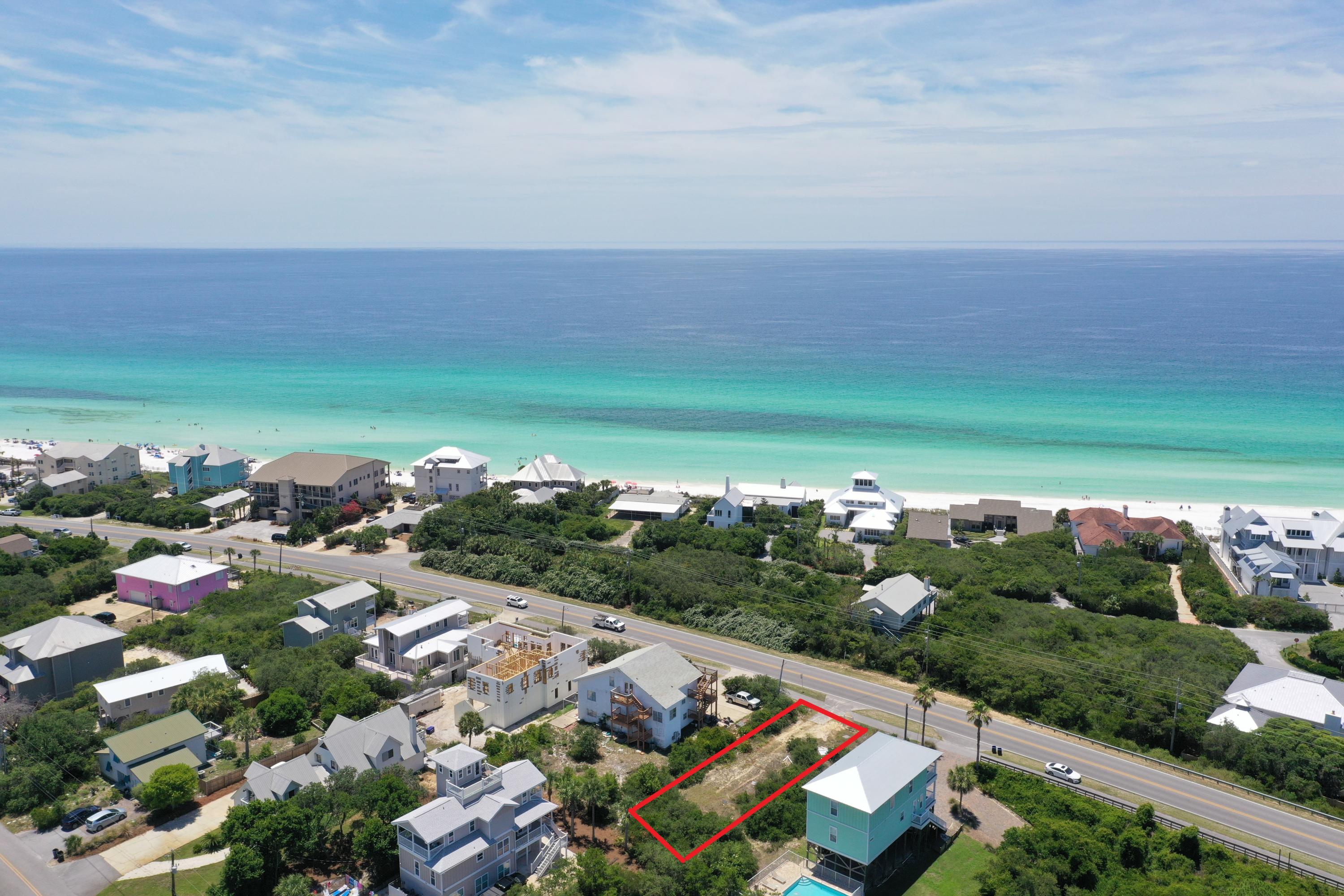 Lot 12 Beach Highlands Santa Rosa Beach Santa Rosa Beach, FL 32459 - Photo 5 of 8 an aerial view of a city with lots of residential buildings and mountain view in back