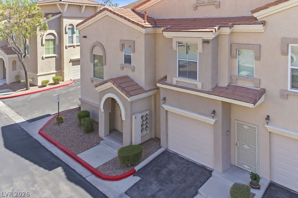 10550 West Alexander Road, Unit 2133 Las Vegas, NV 89129 - Photo 21 of 42 This residential exterior showcases contemporary architectural details, offering comfort and convenience.