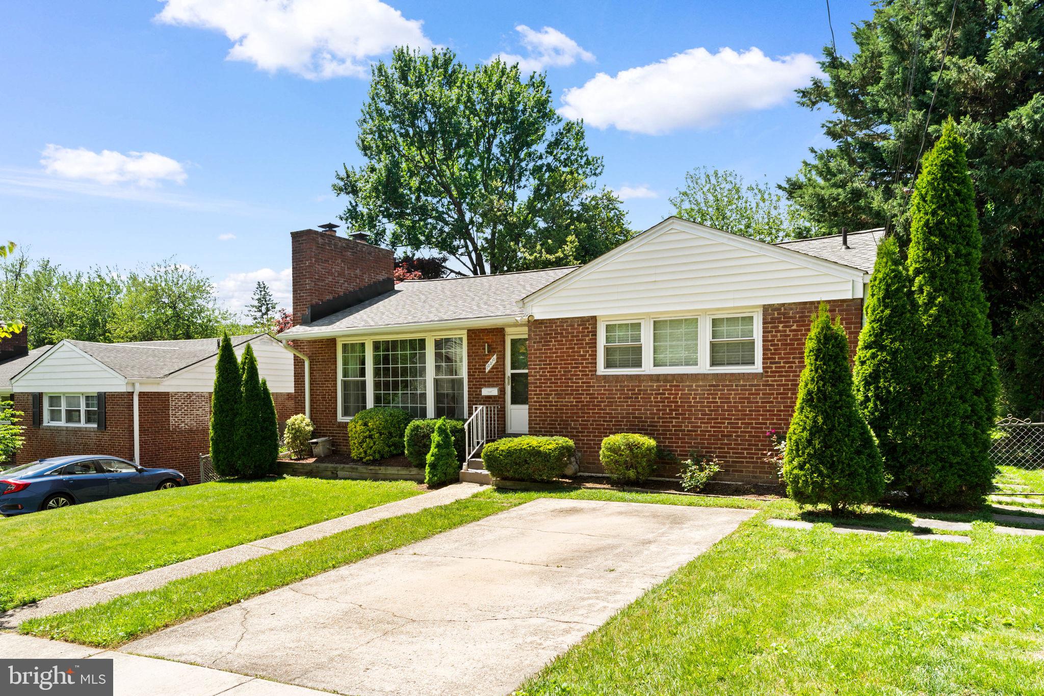 10310 Brunswick Avenue Silver Spring, MD 20902 - Photo 2 of 43 Charming brick home with lush greenery.
