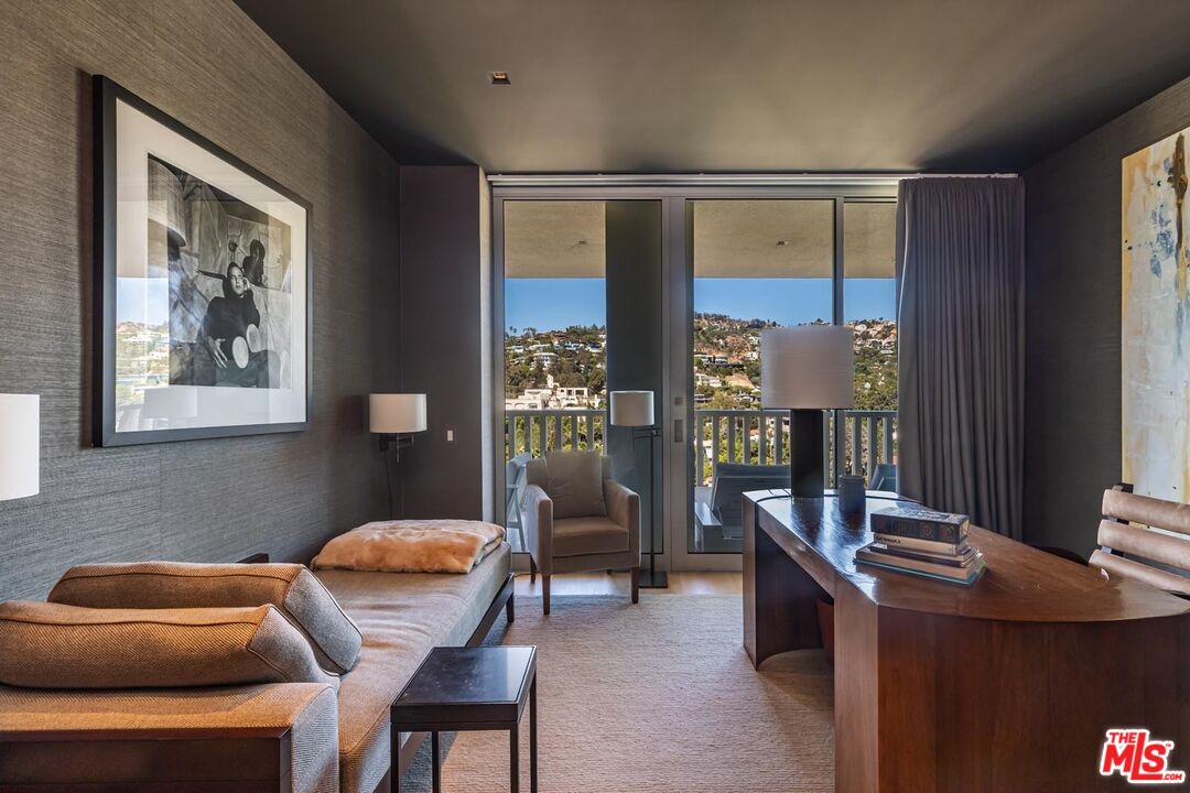 9255 Doheny Road, Unit 1901 West Hollywood, CA 90069 - Photo 11 of 23 a living room with furniture and a window