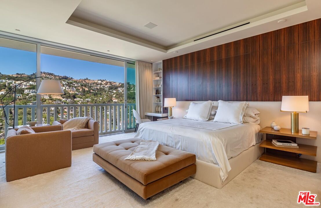 9255 Doheny Road, Unit 1901 West Hollywood, CA 90069 - Photo 14 of 23 a bed room with a bed and a couch