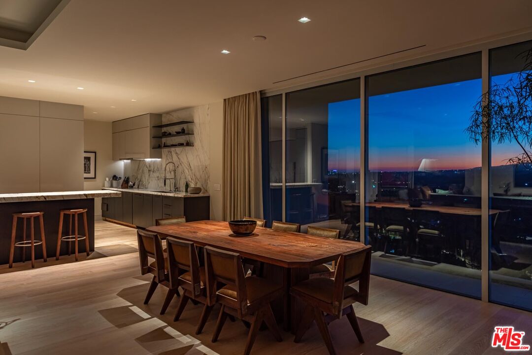 9255 Doheny Road, Unit 1901 West Hollywood, CA 90069 - Photo 21 of 23 a view of a dining room with furniture