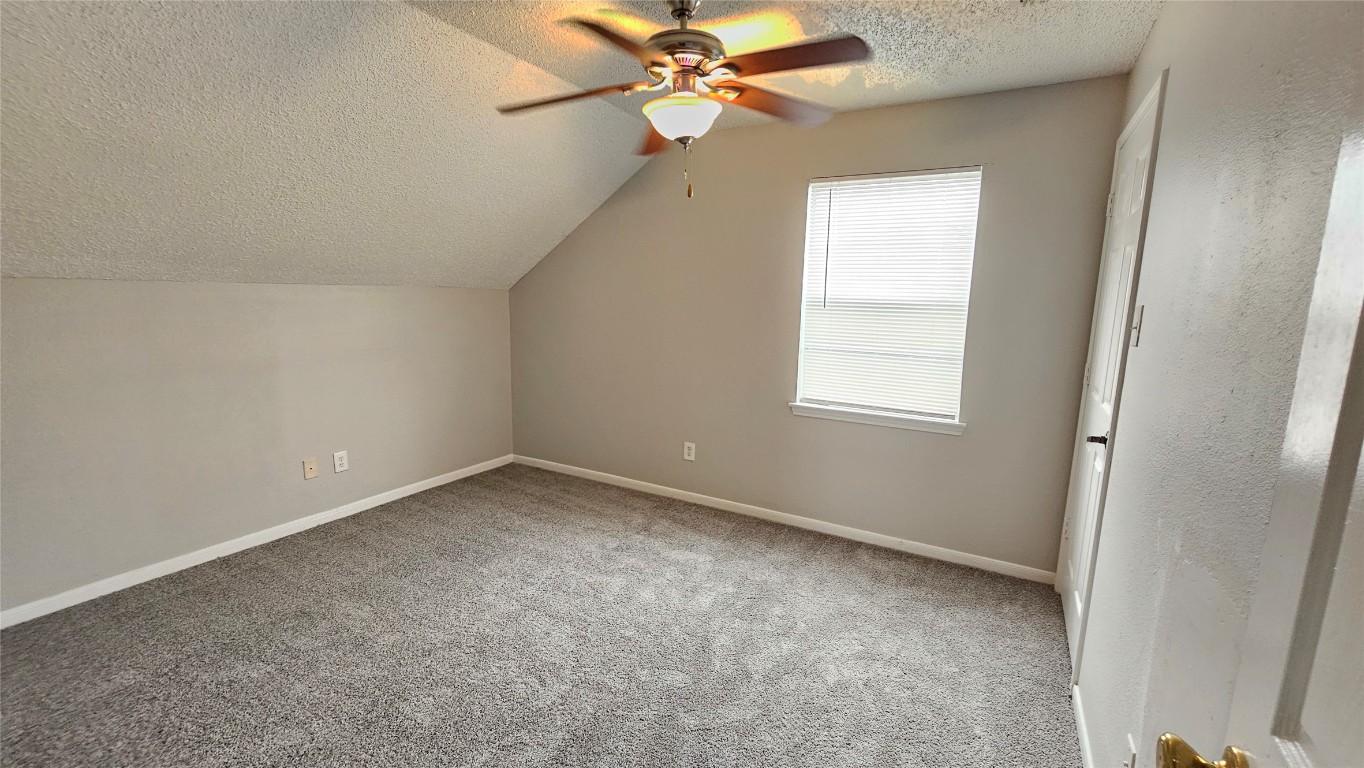 7704 Sign Street Houston, TX 77489 - Photo 17 of 27 an empty room with a window and a fan
