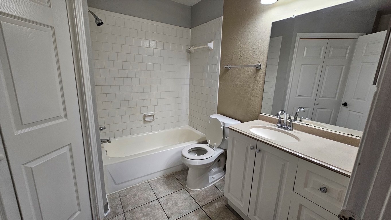 7704 Sign Street Houston, TX 77489 - Photo 23 of 27 a bathroom with a sink a toilet and shower