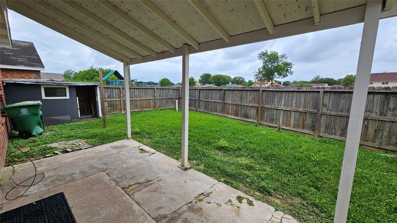 7704 Sign Street Houston, TX 77489 - Photo 27 of 27 a view of a backyard with a garden