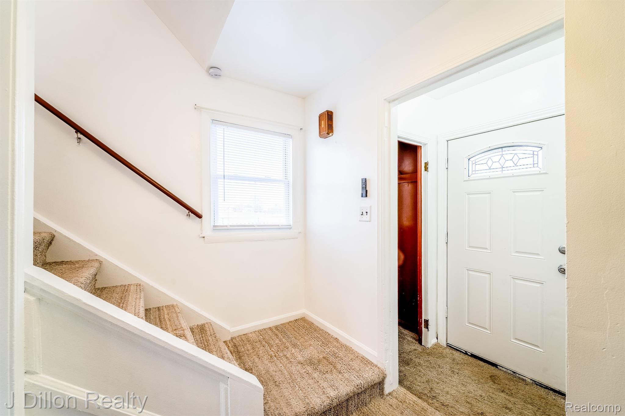 99 Chestnut Street River Rouge, MI 48218 - Photo 24 of 50 Foyer entrance featuring stairs and light colored carpet