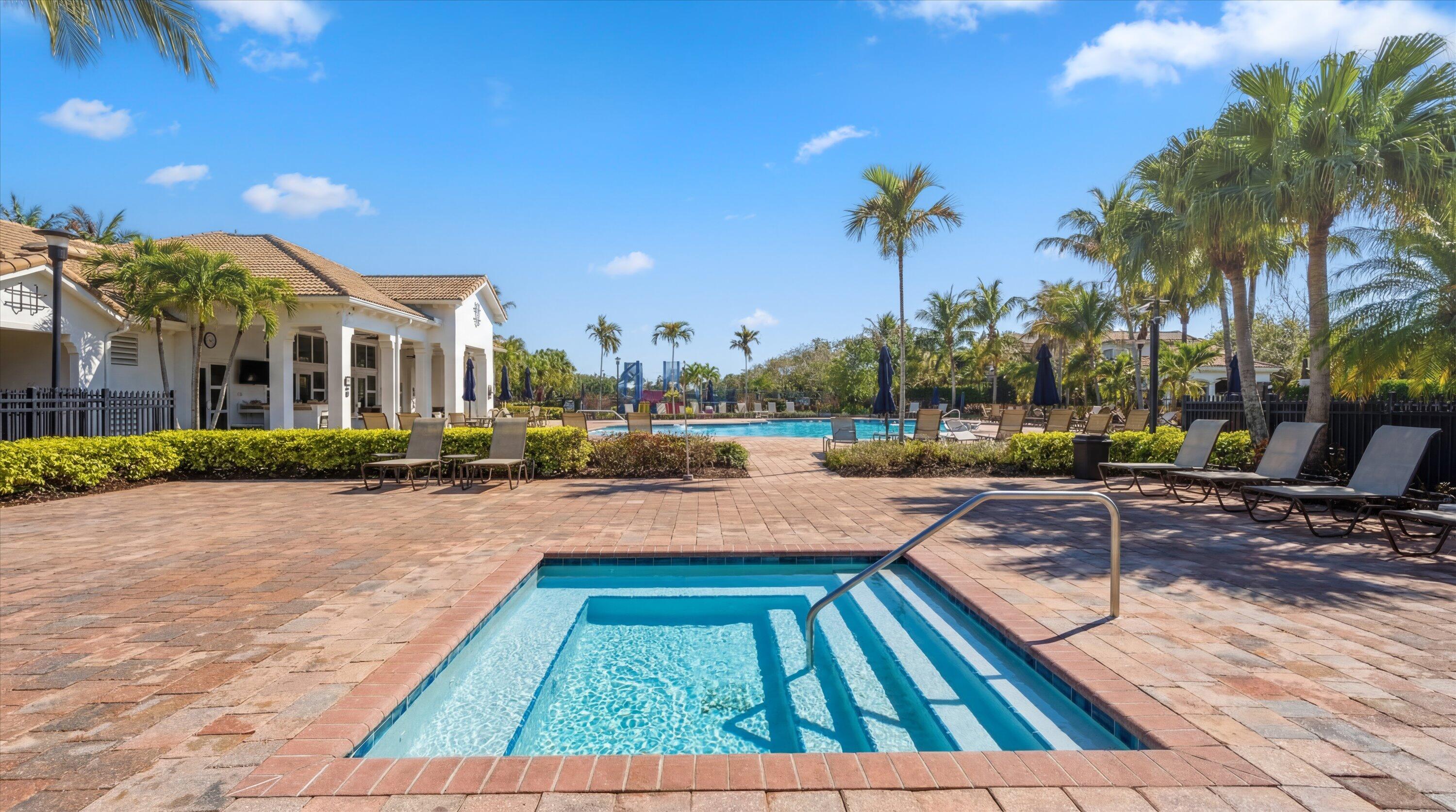 108 Casa Circle Jupiter, FL 33458 - Photo 49 of 53 a swimming pool with outdoor seating and yard