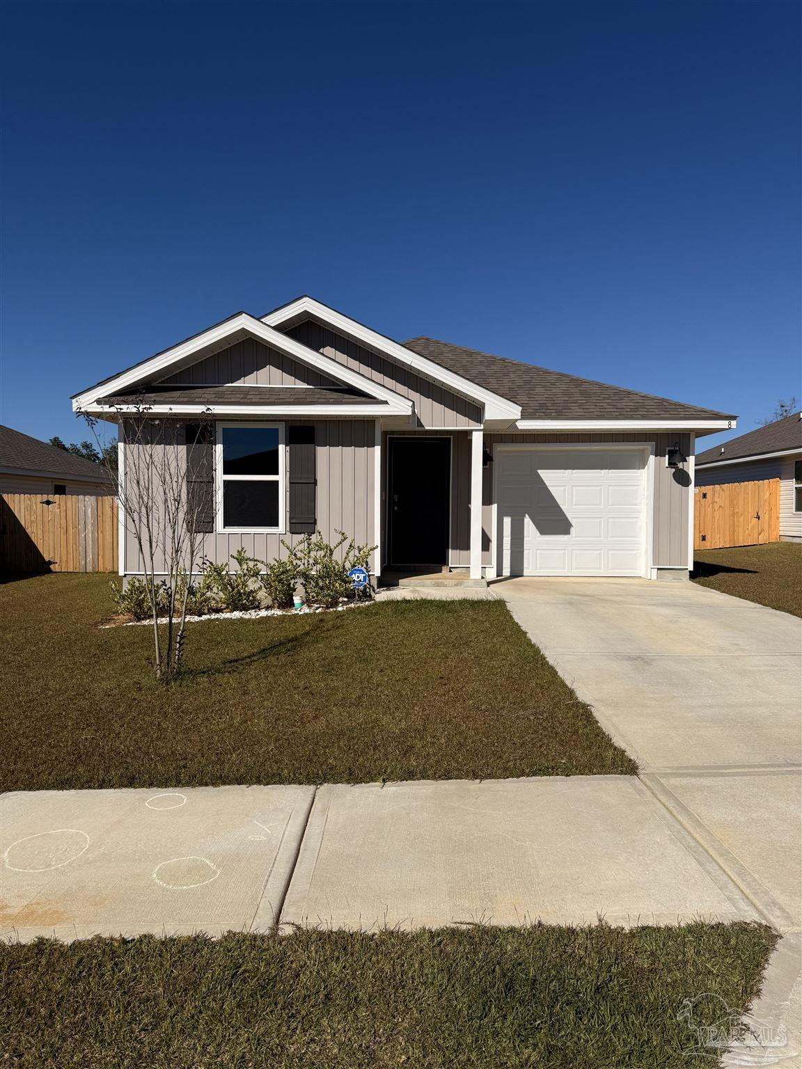 8 Spoonbill Street Cantonment, FL 32533 - Photo 1 of 22 a front view of a house with yard