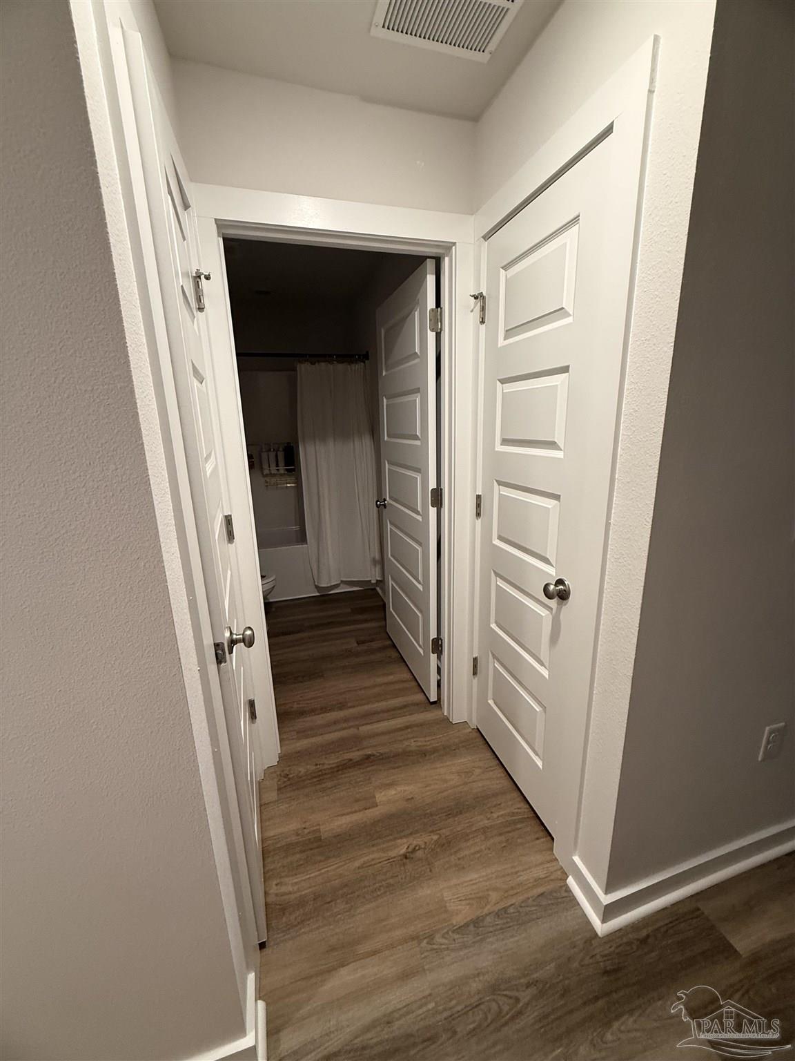 8 Spoonbill Street Cantonment, FL 32533 - Photo 13 of 22 a view of a hallway with wooden floor and stairs