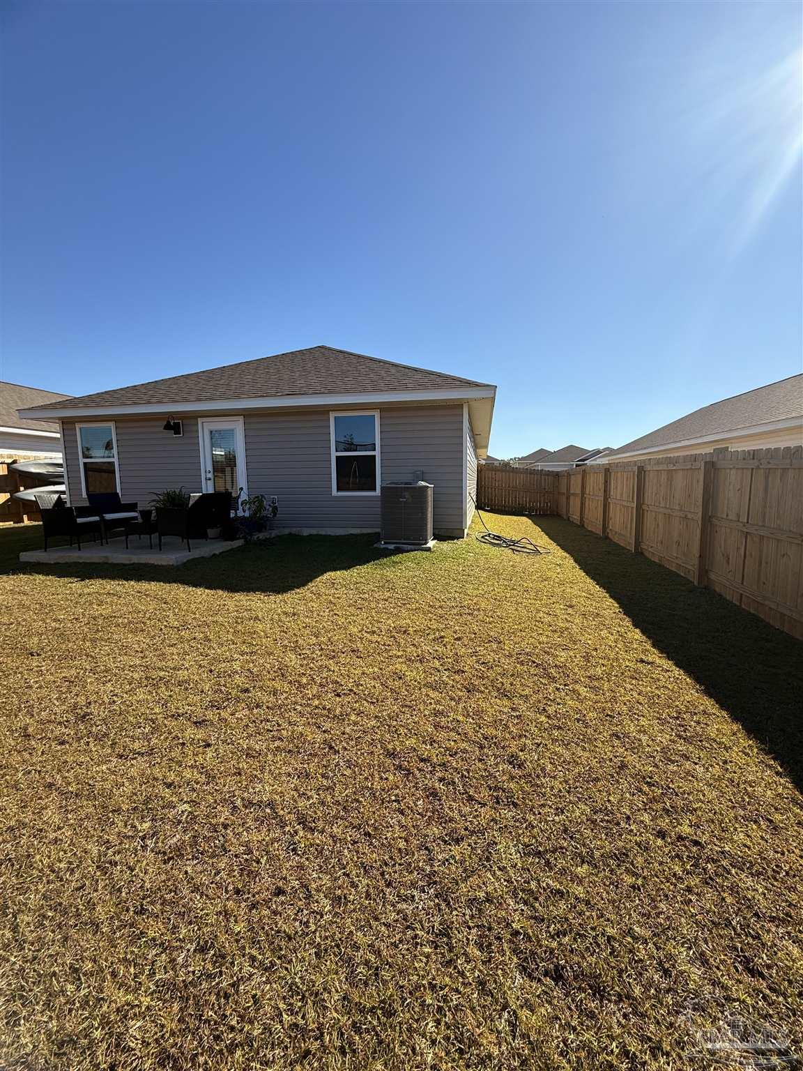8 Spoonbill Street Cantonment, FL 32533 - Photo 6 of 22 a view of a house with a yard