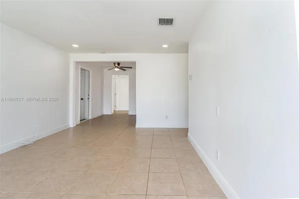 a kitchen with stainless steel appliances granite countertop a sink and a refrigerator