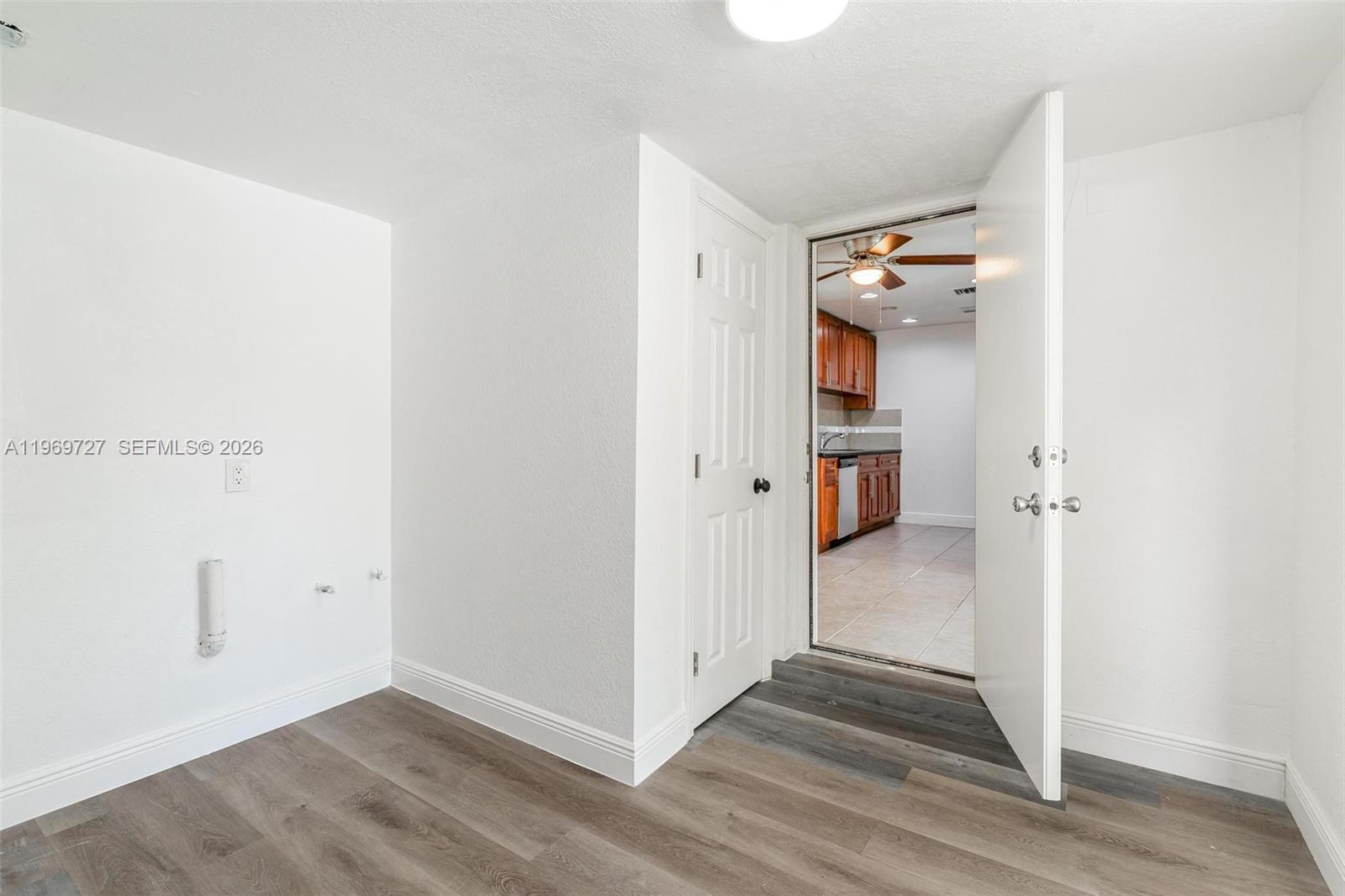 5615 Simms Street Hollywood, FL 33021 - Photo 21 of 27 a view of a hallway with wooden floor