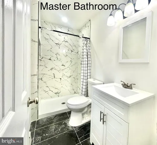 a bathroom with a sink mirror and