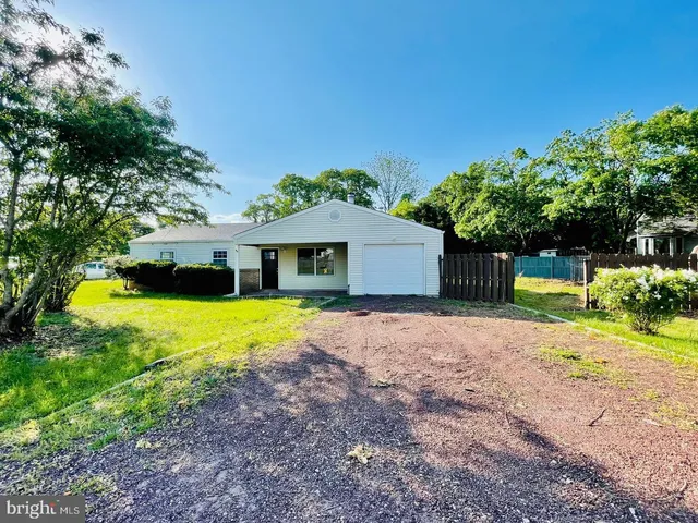 a kitchen with a sink cabinets and window