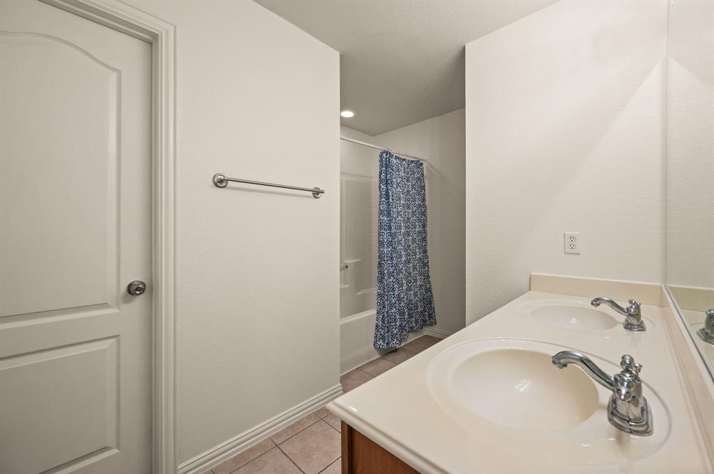 808 Briar Ridge Drive Keller, TX 76248 - Photo 26 of 40 Bathroom featuring a double vanity with integrated sinks, chrome fixtures, and a spacious countertop