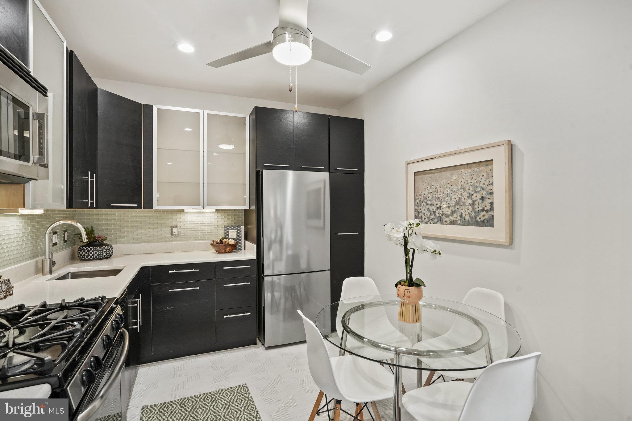 1669 Columbia Road Northwest, Unit 201 Washington, DC 20009 - Photo 11 of 31 Stylish kitchen cabinets, under counter lighting