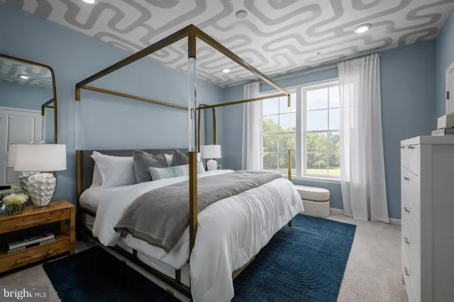 a bedroom with bed and window