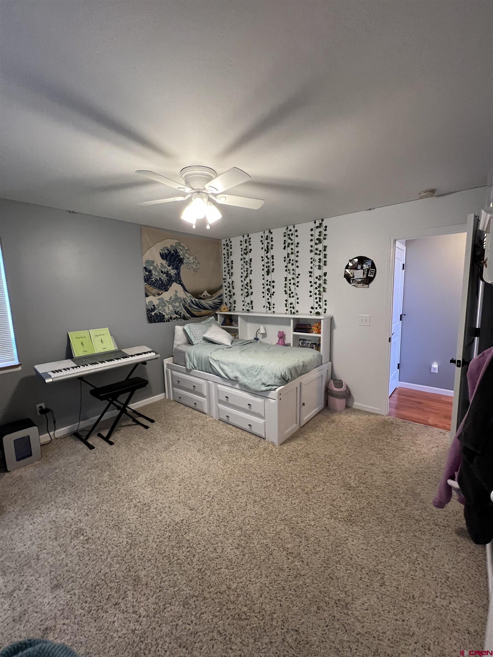 22350 Surface Creek Road Cedaredge, CO 81413 - Photo 19 of 32 a living room with furniture and a flat screen tv
