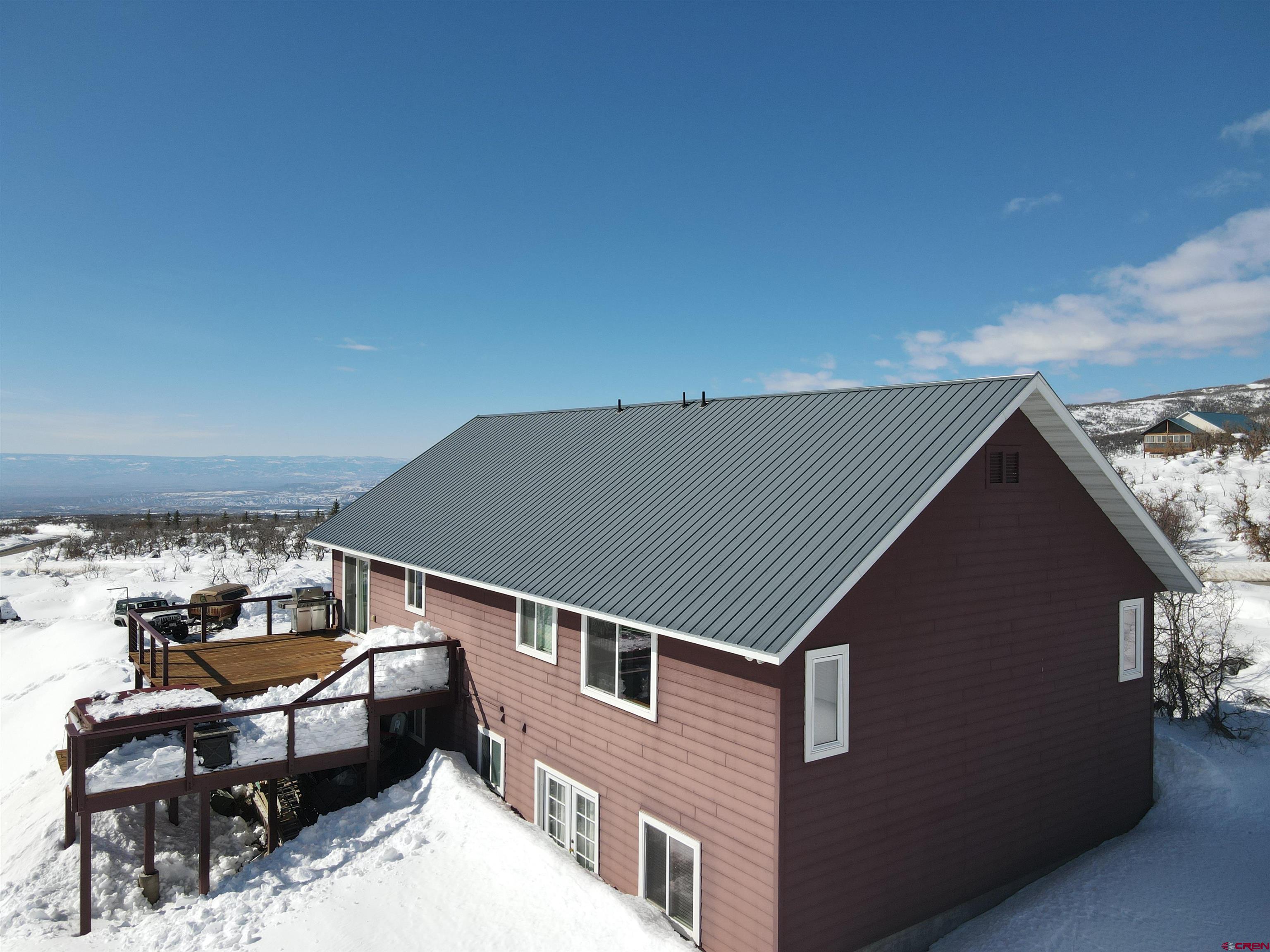 22350 Surface Creek Road Cedaredge, CO 81413 - Photo 32 of 32 a terrace of a house with outdoor seating