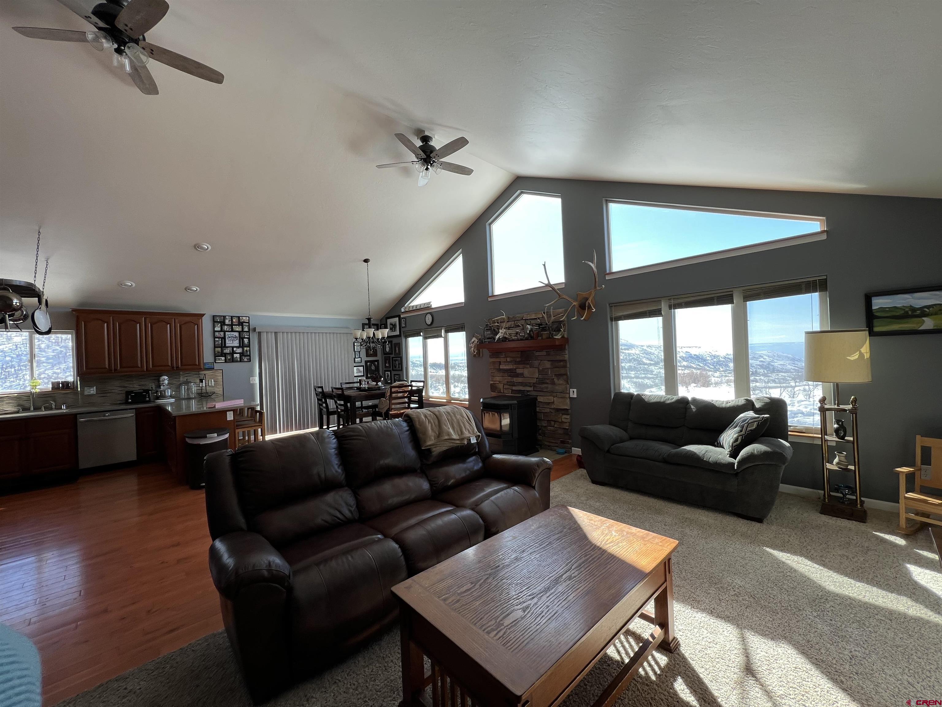 22350 Surface Creek Road Cedaredge, CO 81413 - Photo 10 of 32 a living room with furniture and a large window