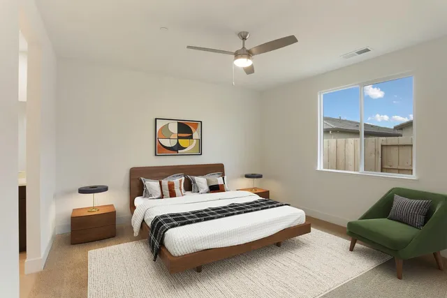 a bedroom with a bed and a couch