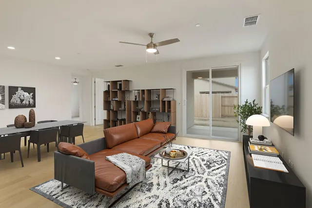 a living room with furniture and a rug