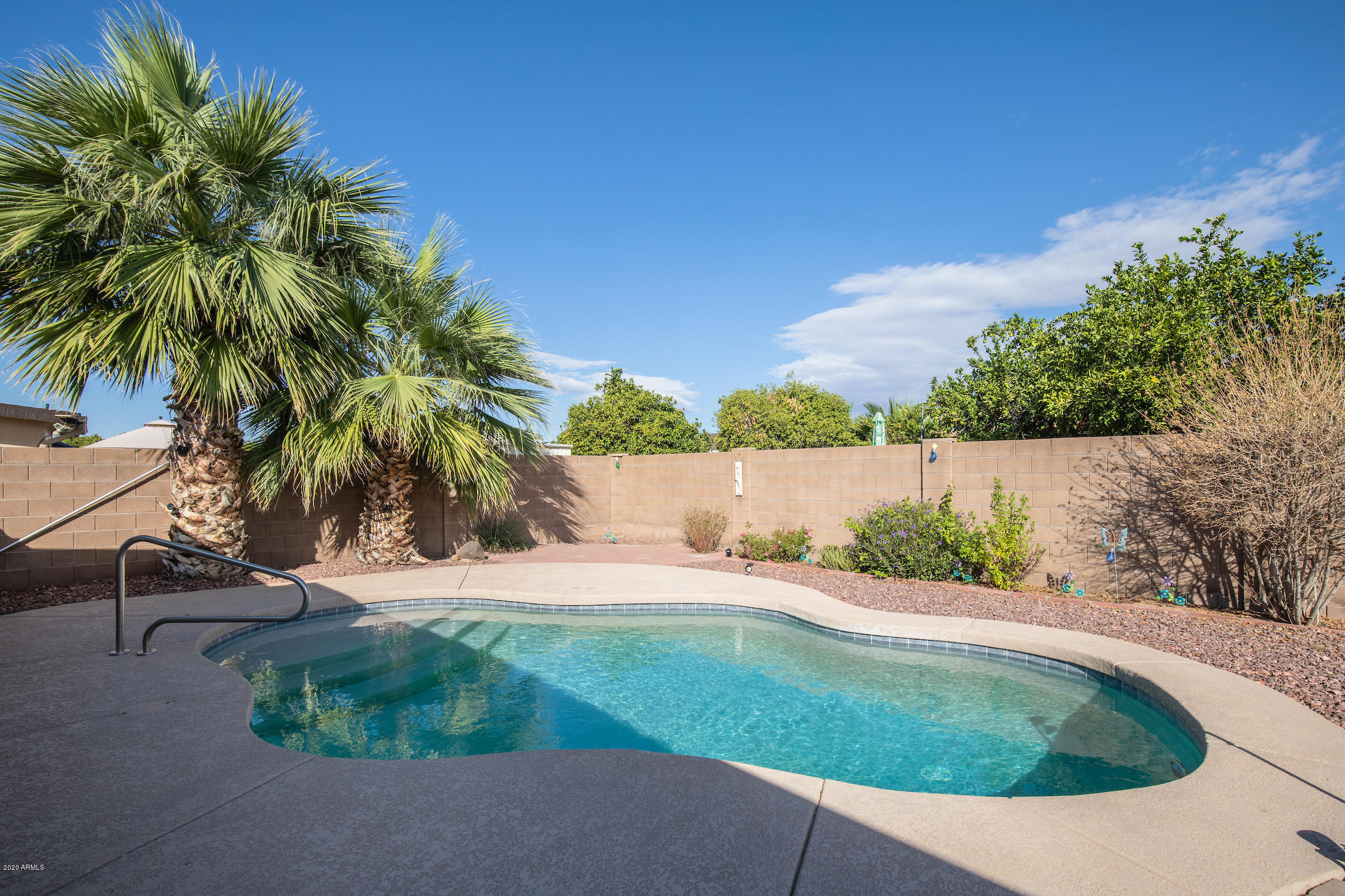 5320 East Decatur Street Mesa, AZ 85205 - Photo 32 of 34 a view of a swimming pool with a yard