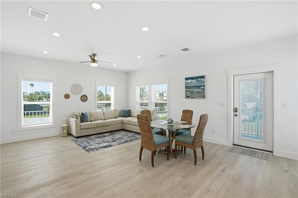 1 Fairview Boulevard Fort Myers Beach, FL 33931 - Photo 9 of 48 a living room with furniture and a large window