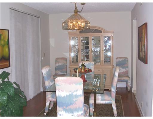 7727 La Mirada Drive, Unit 118 Boca Raton, FL 33433 - Photo 4 of 16 a dining room with furniture and chandelier kitchen view