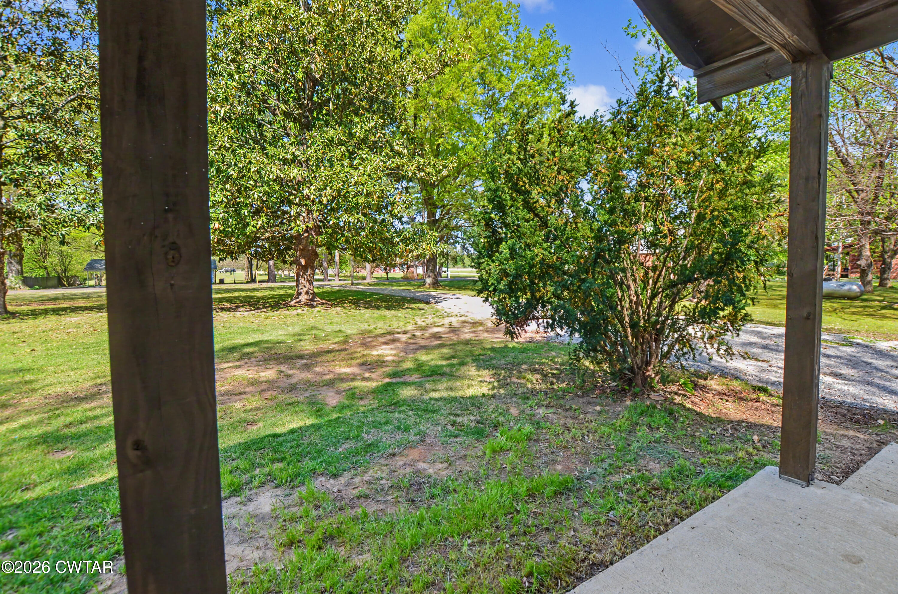 4177 Gum Flat Road Bells, TN 38006 - Photo 12 of 30 a backyard of a house with lots of green space