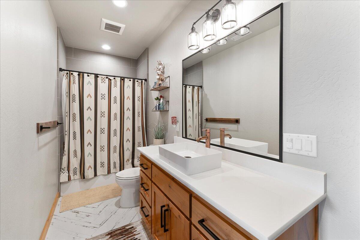 2220 Butte Falls Highway Eagle Point, OR 97524 - Photo 42 of 69 a bathroom with a sink a mirror and a shower
